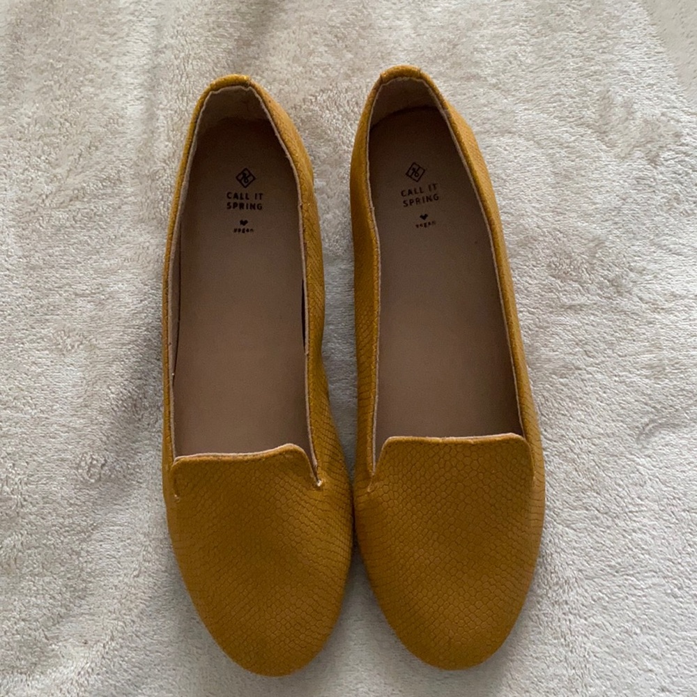 Yellow flats from Call It Spring. Size 7.